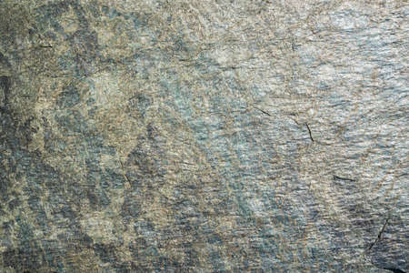 old green rock structure with gradient. natural stone background textureの写真素材