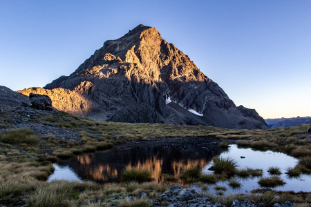 View of Mount Traverse from the Upper Traverse Saddle near St. Arnaud, South Island, New Zealand, just at sunriseの写真素材