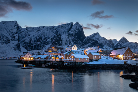 The beautiful Sakrisoy Rorbuer at the Lofoten Islands in Norway in winter and in duskの写真素材