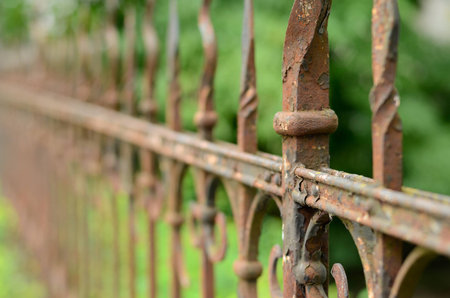 A decorated rusted iron fence