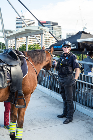 Brisbane, Australia - July 9, 2017: Queensland mounted police officer on the Goodwill Bridge crossing the Brisbane River in central Brisbane.のeditorial素材
