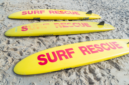 Melbourne, Australia - February 11, 2017: Surf Rescue surfboards on Aspendale Beach in Melbourne. Surfboards are a commonly used tool for lifesavers.のeditorial素材