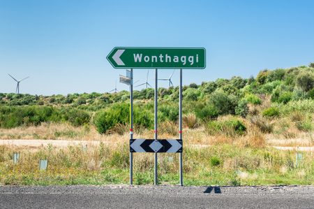 Road sign at a road intersection pointing to Wonthaggi in South Gippsland in Australia.の写真素材