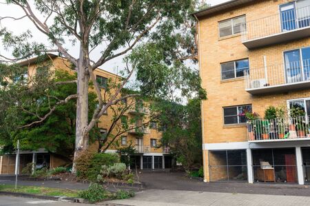 Melbourne, Australia - June 9, 2019: brick low-rise apartment building in O'Shanassy Street, a wide residential street in the inner suburb of North Melbourne.のeditorial素材