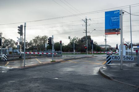 Melbourne, Australia - August 10, 2019: Seaford railway station and level crossing in suburban Seaford. The station is on the suburban Frankston Metro line.のeditorial素材