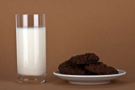chocolate cookies with a glass of milkの写真素材