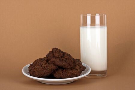 chocolate cookies with a glass of milkの写真素材