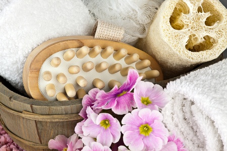 pink flowers brush and sponge for wellness in a beauty spaの写真素材