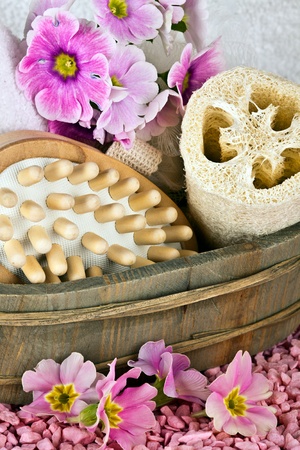 pink flowers brush and sponge for wellness in a beauty spaの写真素材
