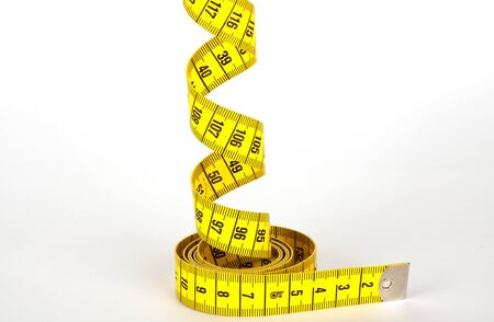 yellow measure tape with scale in centimetersの写真素材