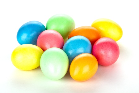 eastern eggs in different colours in a basket with a rabbitの写真素材