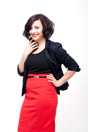 young business woman is talking on the mobile phoneの写真素材