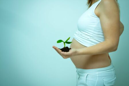 older pregnant woman looks forward to her babyの写真素材