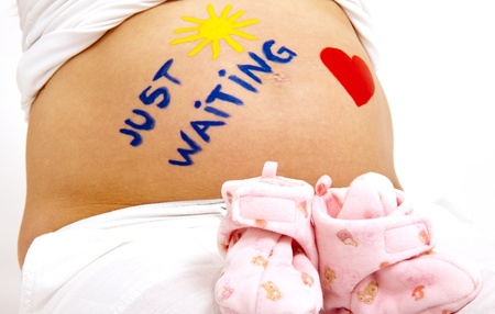 older pregnant woman looks forward to her babyの写真素材
