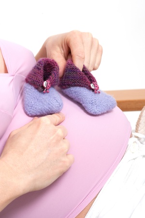 older pregnant woman looks forward to her babyの写真素材
