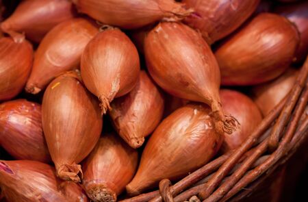 onion in a basket on a marketの写真素材