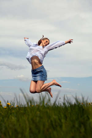 young woman is happy outdoor in summerの写真素材