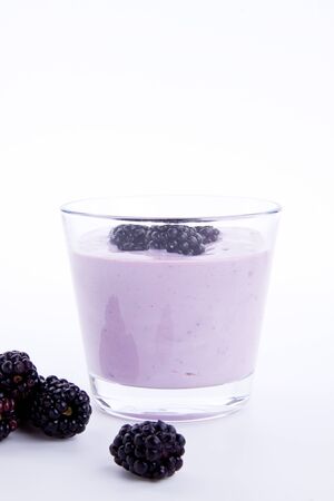 fresh tasty blackberry yoghurt shake dessert isolated on white backgroundの写真素材