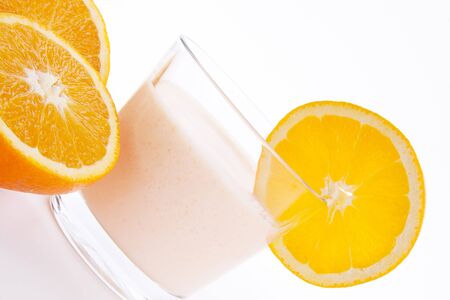 fresh tasty orange yoghurt shake dessert isolated on white backgroundの写真素材