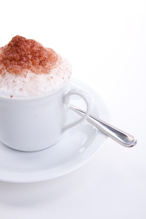 fresh capuccino with chocolate and milk foam isolated on white backgroundの写真素材