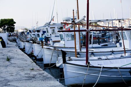 fishing boat in summer outside in sea at harbour backgroundの写真素材