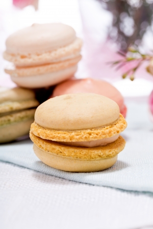 traditional delicious sweet dessert macarons and coffee on tableの写真素材
