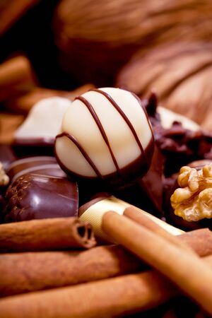 collection of different sweet chocolate pralines closeup background present sugarの写真素材