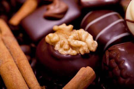collection of different sweet chocolate pralines closeup background present sugar