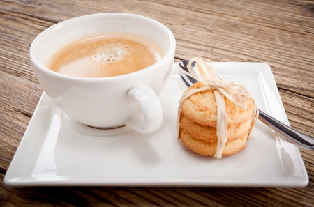 fresh aromatic coffee and cookies on wooden table の写真素材