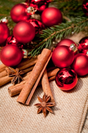 christmas decoration cinnamon anise baubles in red macro closeupの写真素材