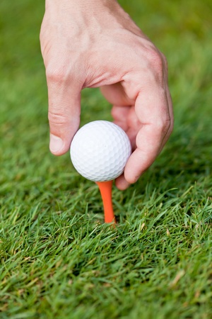 golf ball and iron on green grass detail macro summer outdoor playing golf の写真素材