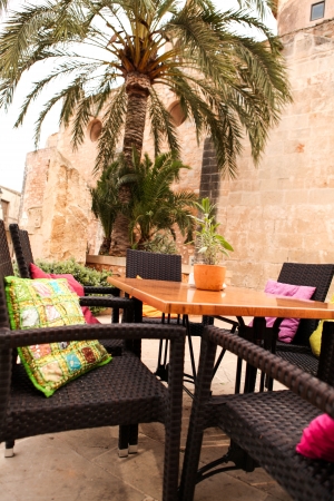 table flower decoration in cafe restaurant outdoor in summer mediterraneanの写真素材