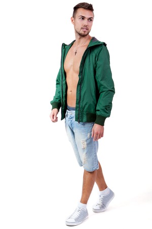 young adult man with green jacket portrait isolated on whiteの写真素材