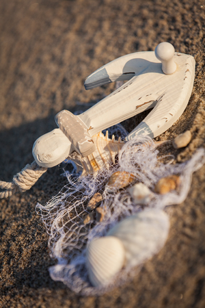 sailing boat and seashell in sand decoration closeup holiday backgroundの写真素材