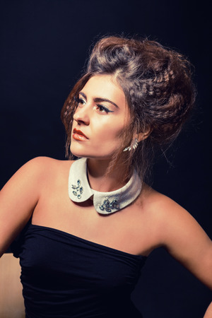 glamour elegant woman portrait with golden makeup on blackの写真素材