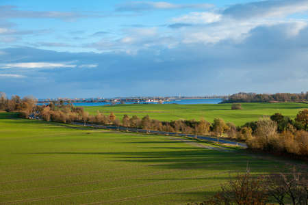 beautiful landscape in autum baltic see green field blue sky nature panoramaの写真素材