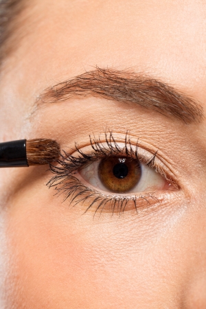 attractive woman in beauty salon make up brown eyeshadow professional の写真素材