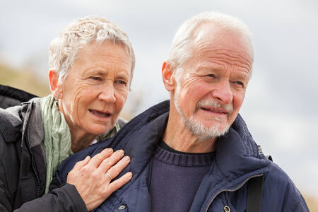 happy elderly senior couple walking on beach healthcare recreation