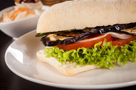 delicious vegan burger with ciabatta bread grilled eggplant and salad