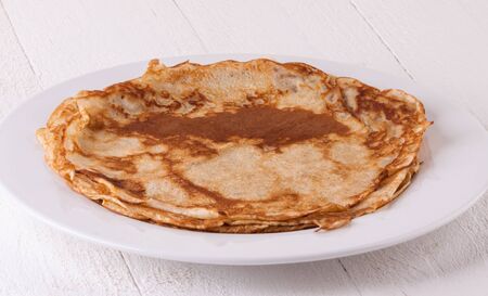 Delicious Pancakes on Plate Served, Isolated on White Wooden Tableの写真素材