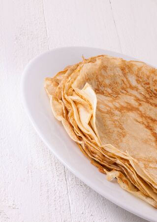 Delicious Pancakes on Plate Served, Isolated on White Wooden Tableの写真素材