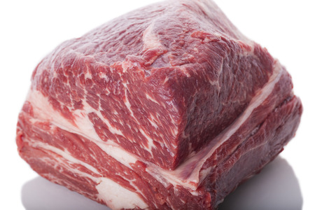 Fresh Slice of Protein Rich Raw Beef Meat on Top of the Table on White Backgroundの写真素材