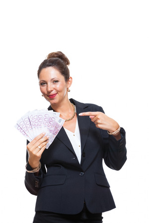Happy Successful Young Businesswoman Holding a Fan of 500 Euro Banknotes and Looking at the Camera, Isolated on White Background.の写真素材