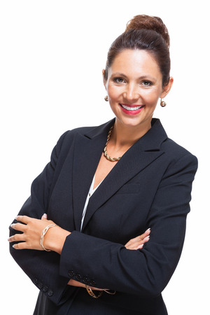 Portrait of a Confident Young Businesswoman in Black Suit, Smiling at the Camera with Arms Crossing Over her Stomach, Isolated on White Backgroundの写真素材