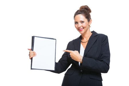 Half Body Shot of a Young Businesswoman Showing a Clean White Document with Copy Space, Isolated on White Background.の写真素材