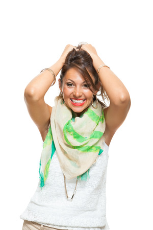 Close up Laughing Pretty Woman with Scarf Around her Neck, Holding Back her Hair with Mouth Wide Open While Looking at the Camera. Isolated on White.の写真素材