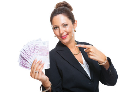 Happy Successful Young Businesswoman Holding a Fan of 500 Euro Banknotes and Looking at the Camera, Isolated on White Background.の写真素材