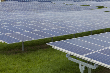 Field with blue siliciom solar cells alternative energy to collect sun energyの写真素材