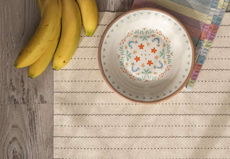 Vintage enamel plate on a table with fruits.の写真素材