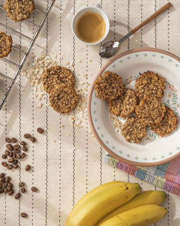 a top view of a table with a freshly baked oat cookies.の写真素材